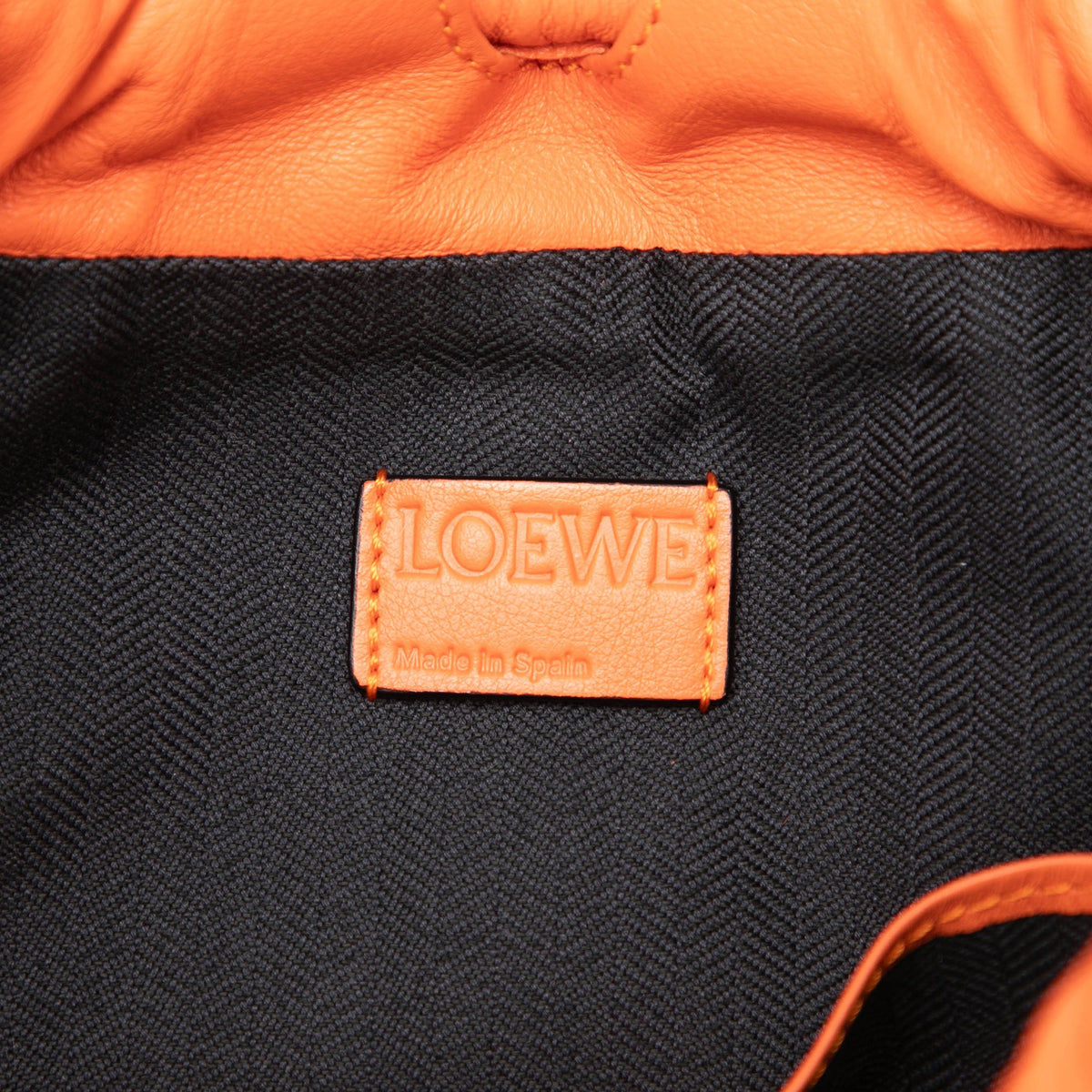LOEWE Embossed Anagram Leather Yago Knot Backpack — Orange