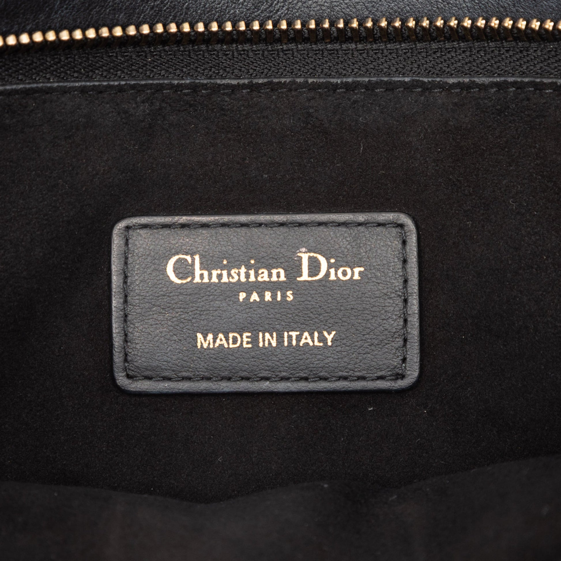 Dior Logo Embossed Leather Clutch