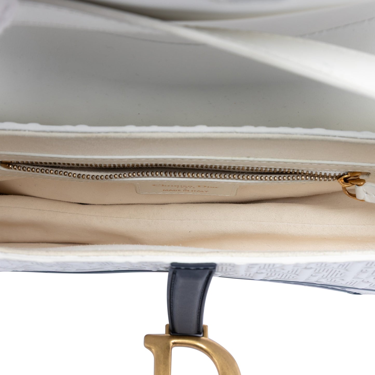 Perforated Oblique Embossed Calfskin Saddle Bag