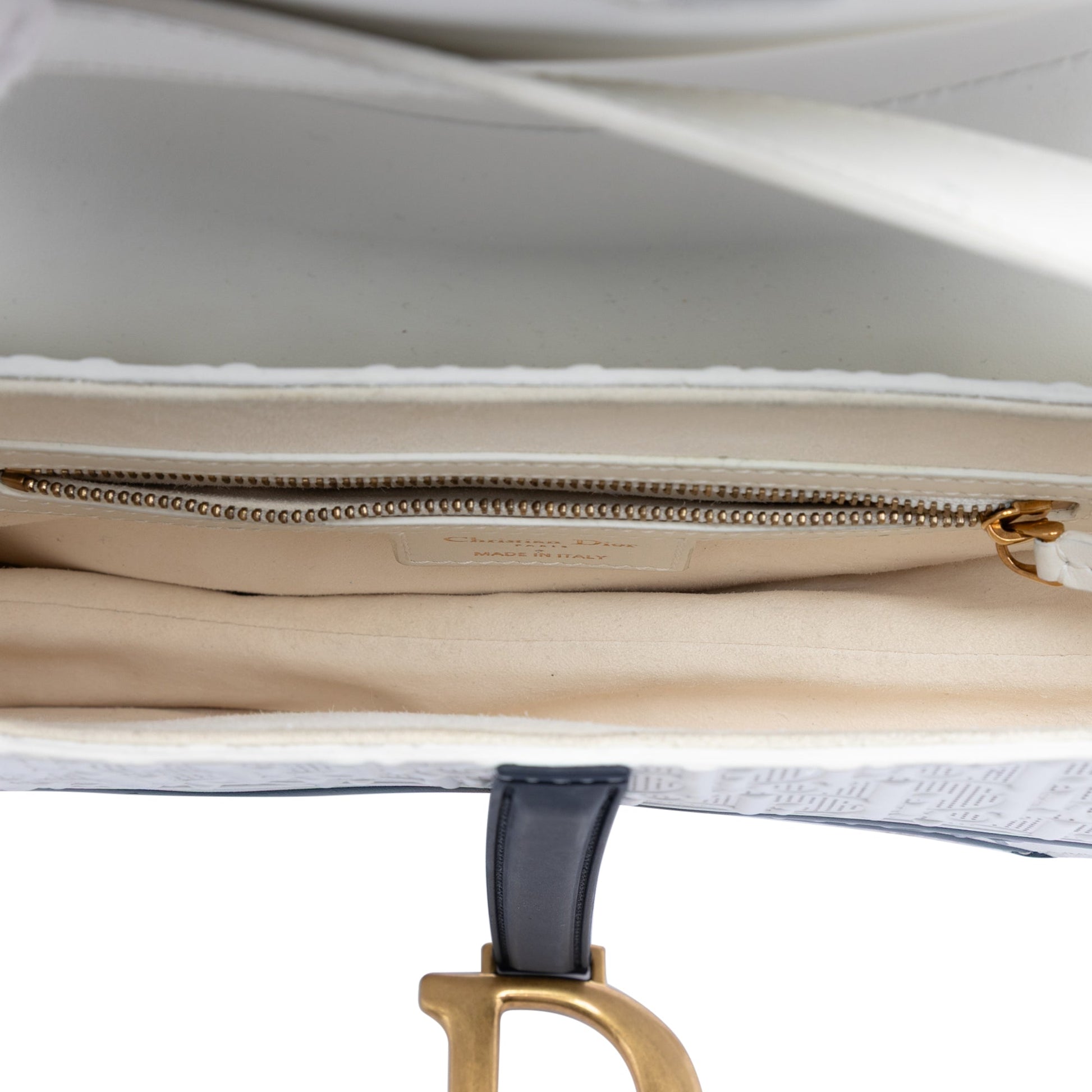 Perforated Oblique Embossed Calfskin Saddle Bag