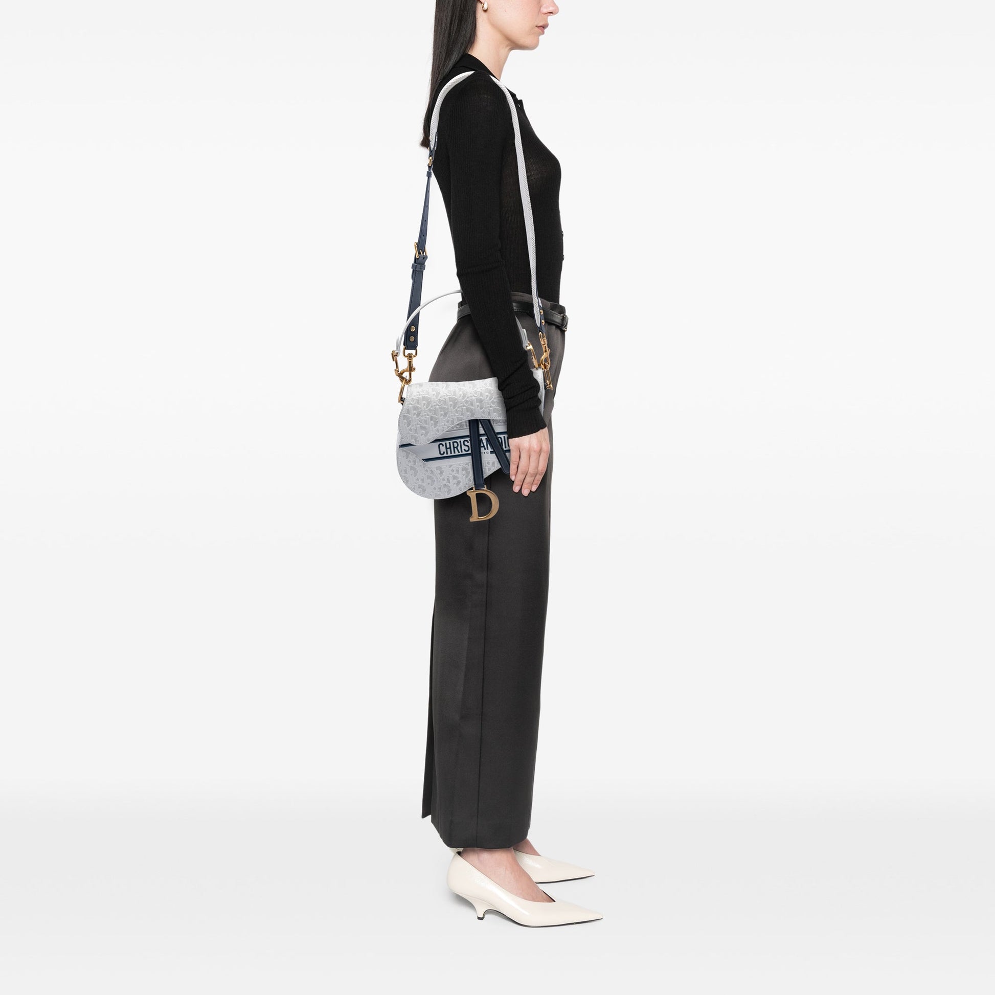 Perforated Oblique Embossed Calfskin Saddle Bag