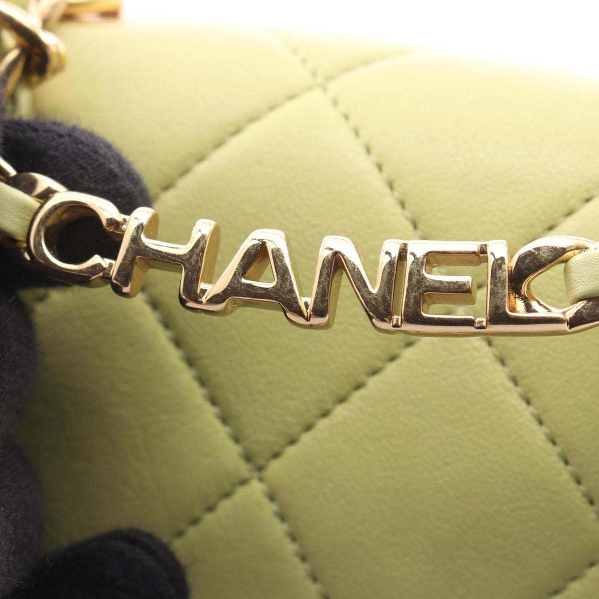 Chanel Mini Quilted Lambskin Oval Logo Chain Top Handle Flap