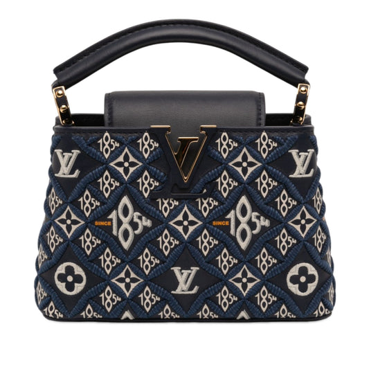 Monogram Since 1854 Capucines BB