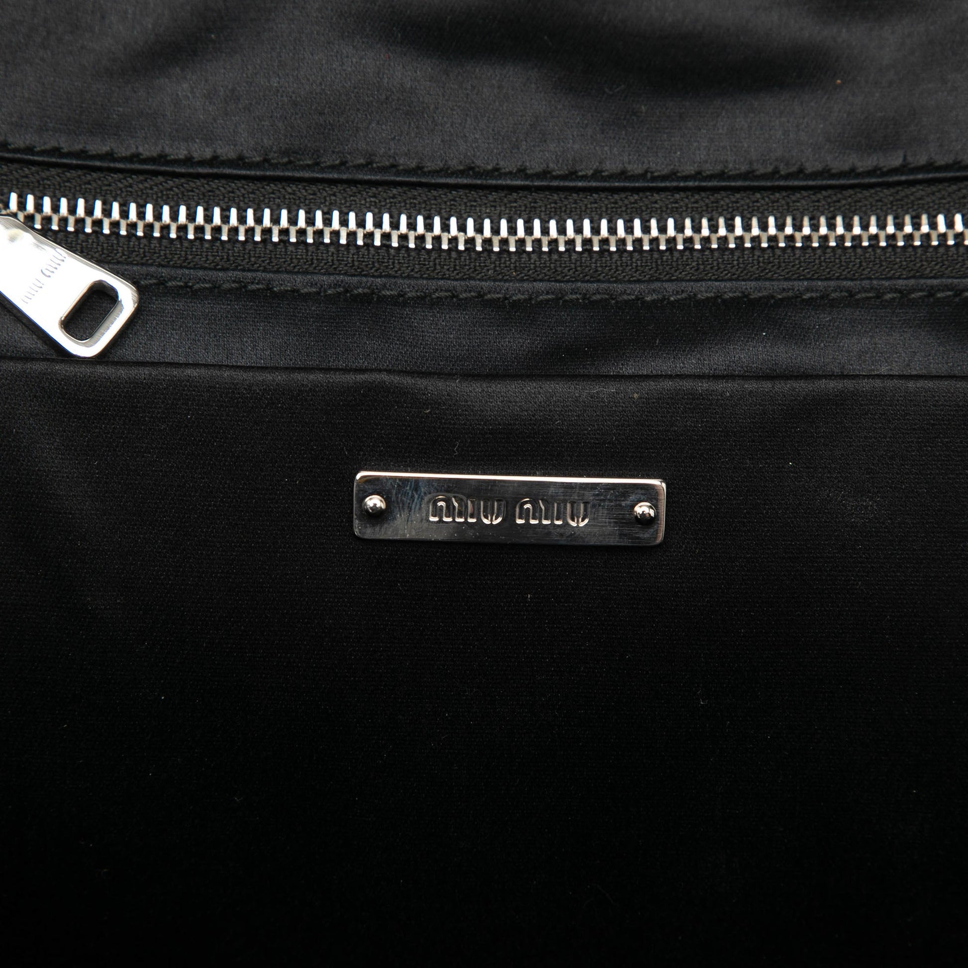 Miu Miu Leather Trimmed Matelasse Crystal Embellished Nylon Backpack