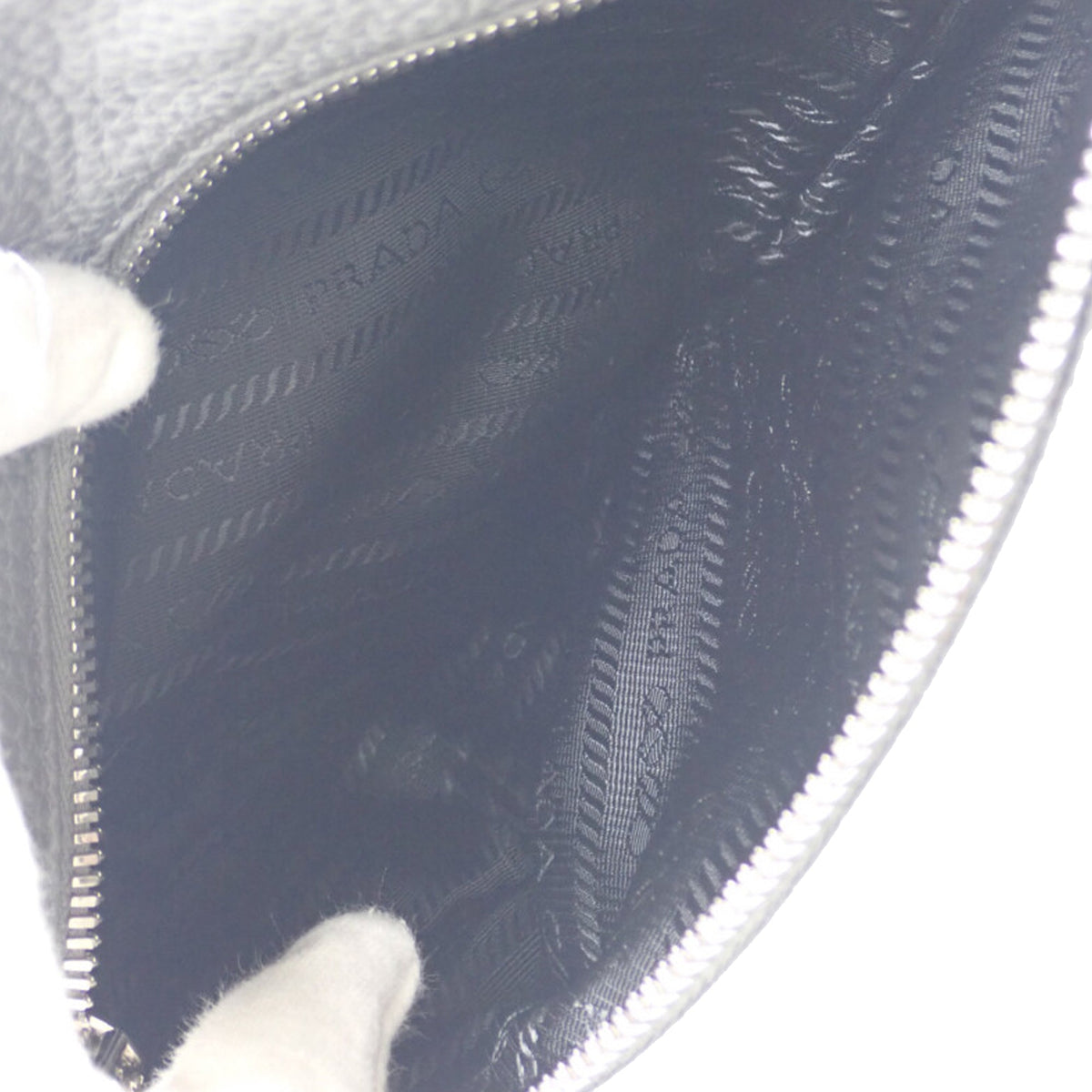 Prada Vitello Daino Logo Embossed Sling Bag