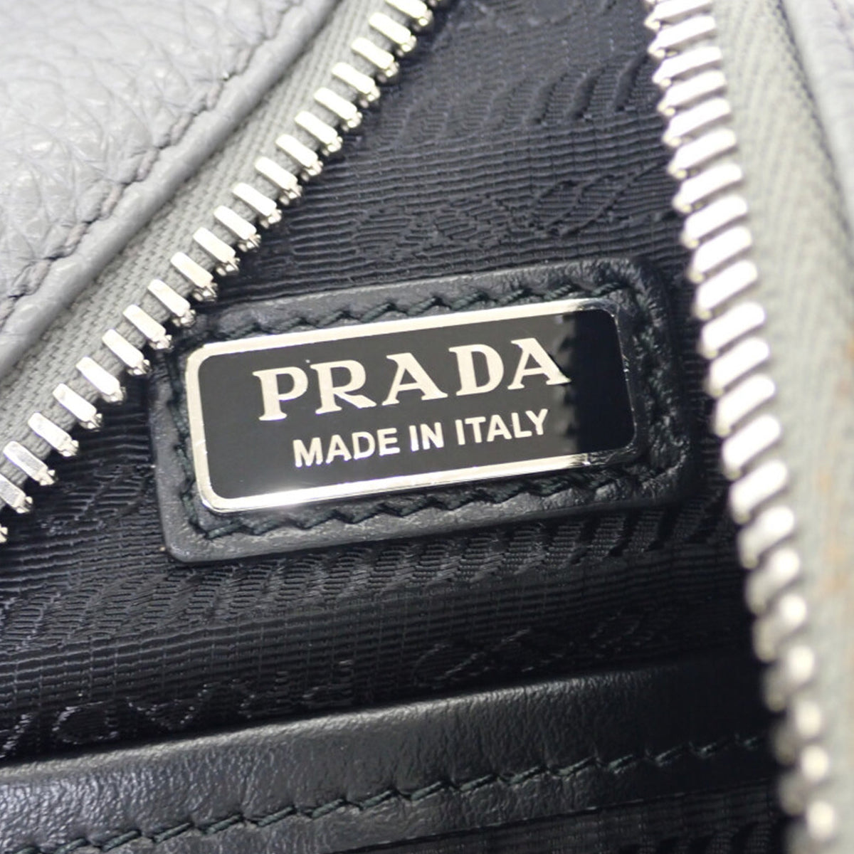 Prada Vitello Daino Logo Embossed Sling Bag