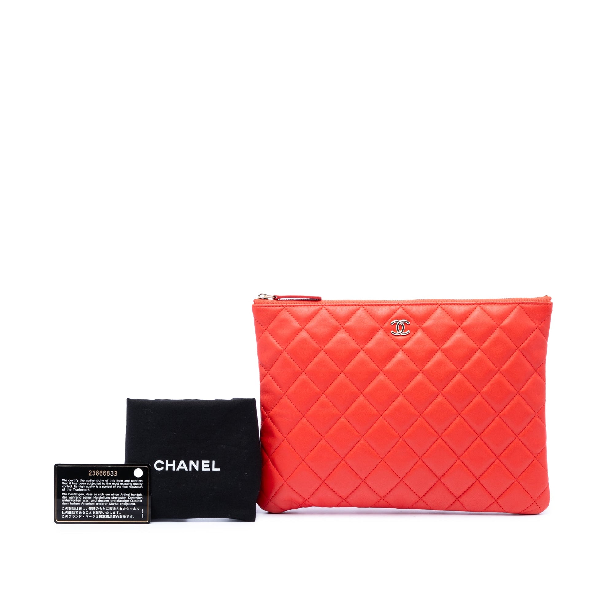Chanel Medium Quilted Lambskin O Case Clutch