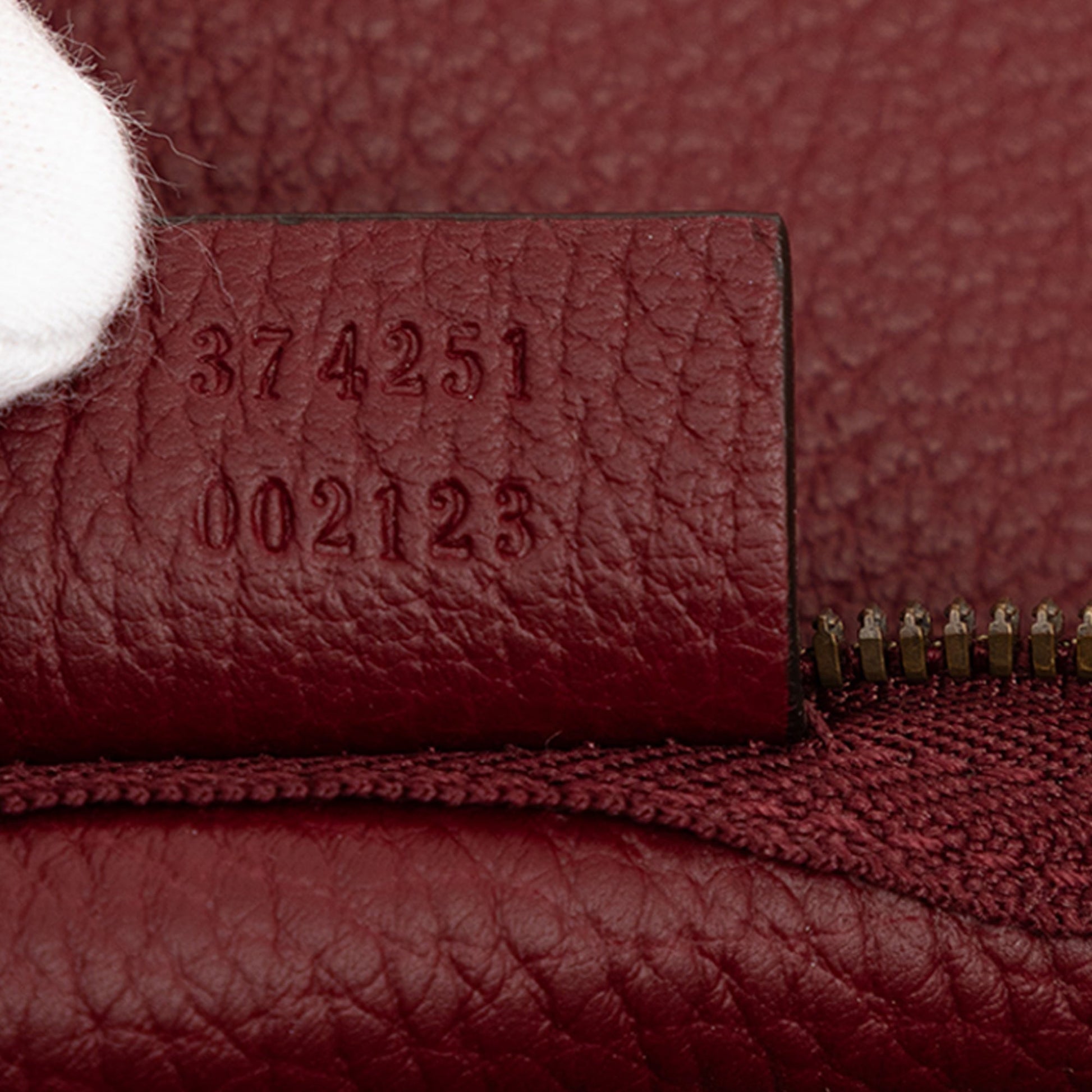 Gucci Grained Leather Vertical Zip Sling Bag